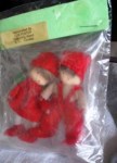 dollhouse dolls in red in pkg